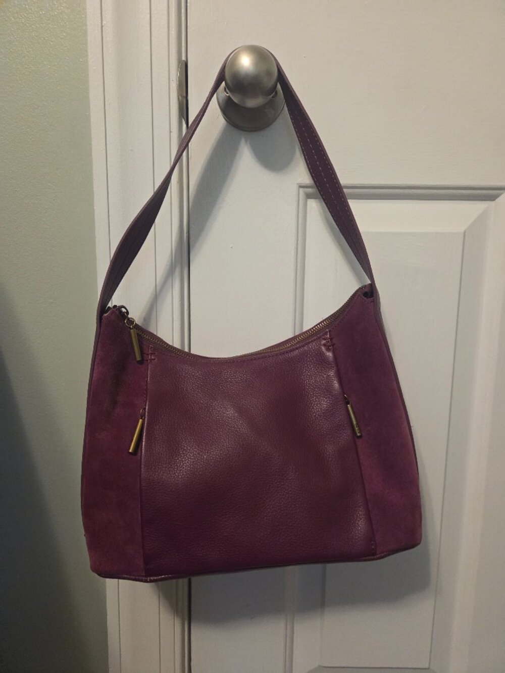 The Sak purple/wine shoulder purse in suede and leather.